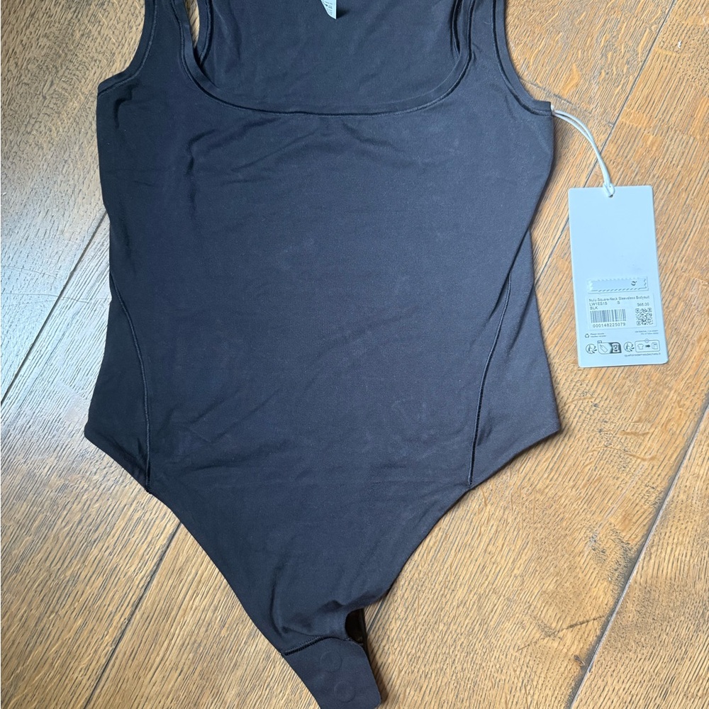 NWT Lululemon Black Sleeveless Bodysuit, size small.